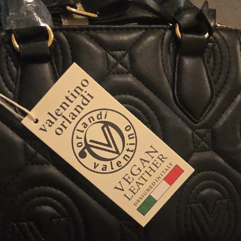 Valentino Orlandi Black Quilted Satchel with Gold Logo Charm and Strap